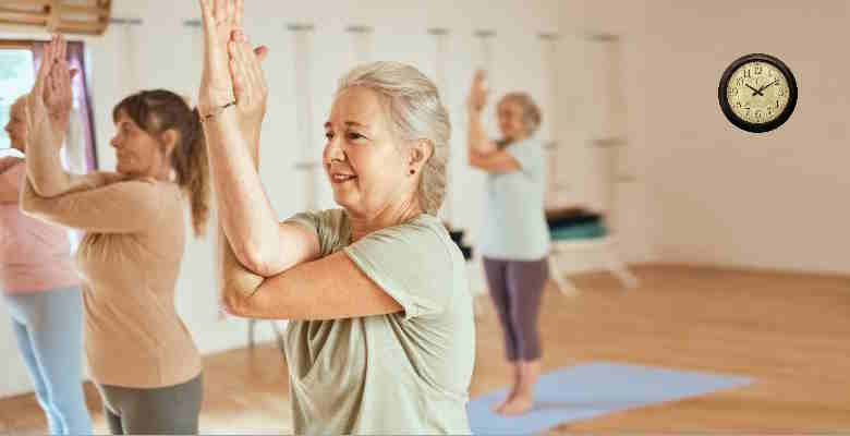 Active seniors practicing mindful movements in exercise class